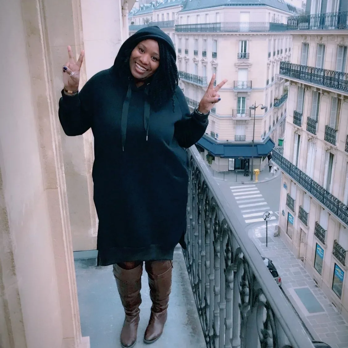 Black knee-length fleece hoodie dress with front pockets