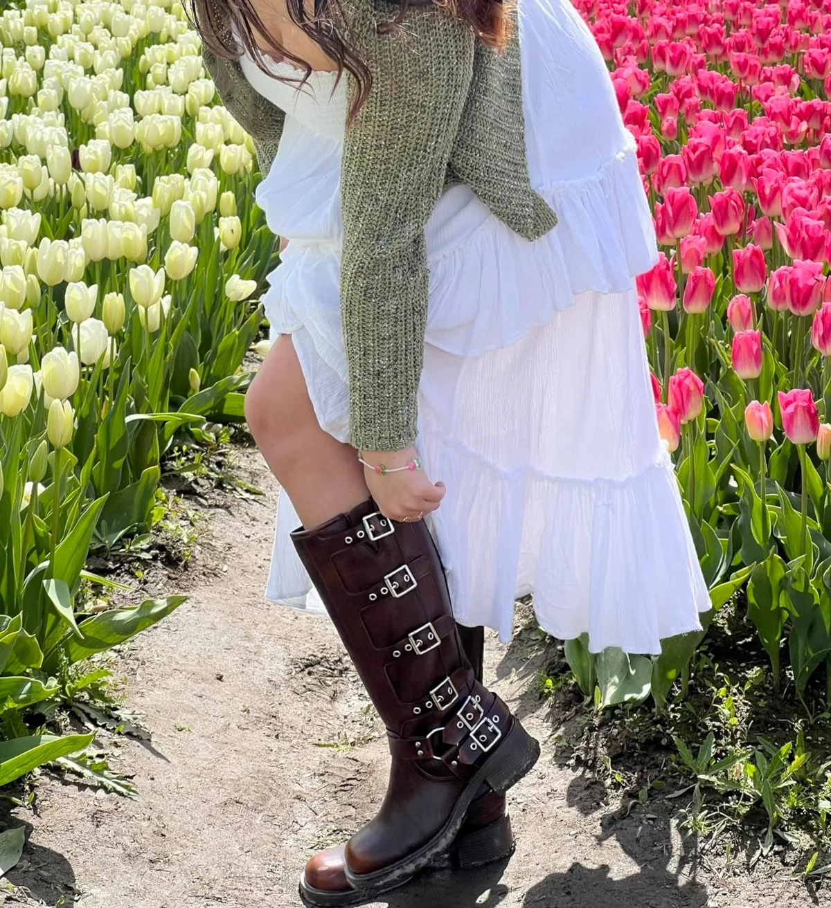 Knee-high buckled moto riding boots with a square toe and chunky heel