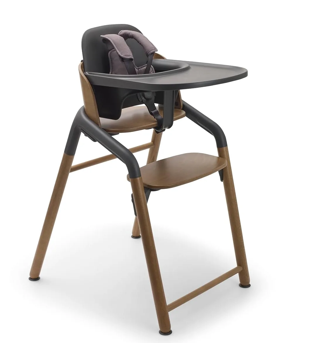Bugaboo Giraffe high chair with walnut-toned beechwood legs, dark seat and wide tray