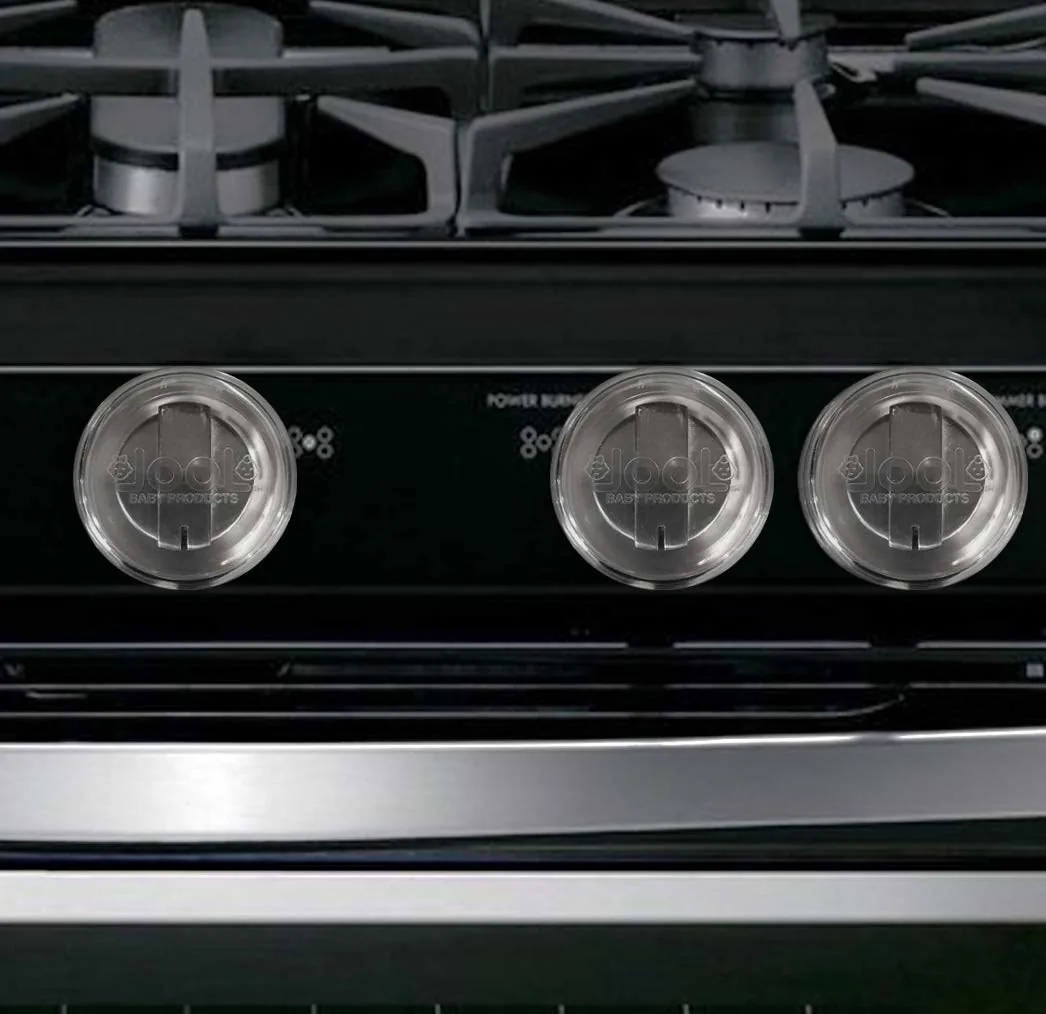 Clear covers fitted over the knobs of a stove