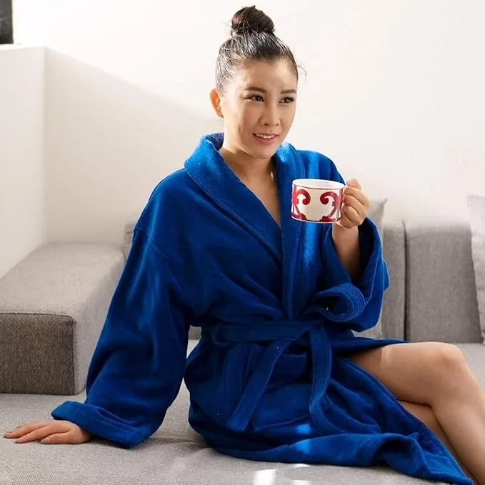 Model in a royal blue cotton terry cloth robe holding a mug