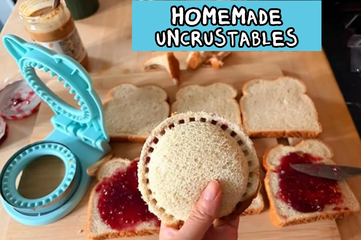 Blue round sandwich cutter and sealer pressing a jelly sandwich on a table