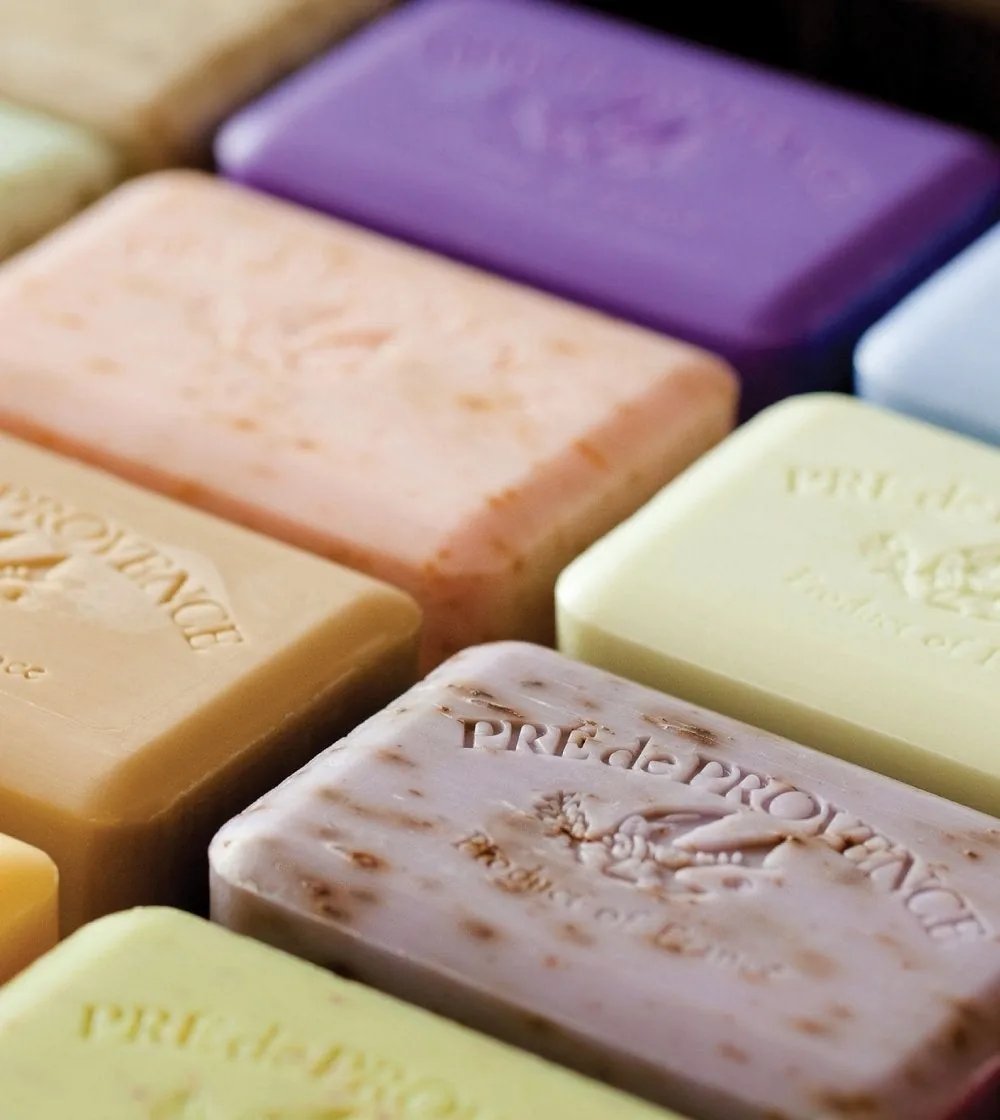 Pastel French milled soap bars stamped with the brand name