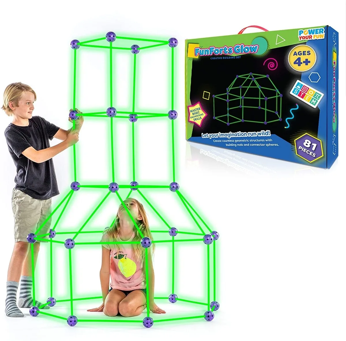 Two children building a fort frame from rods and connector spheres