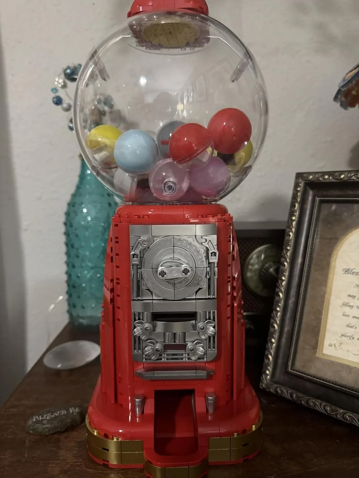 Building block gumball machine filled with colorful capsules on a table
