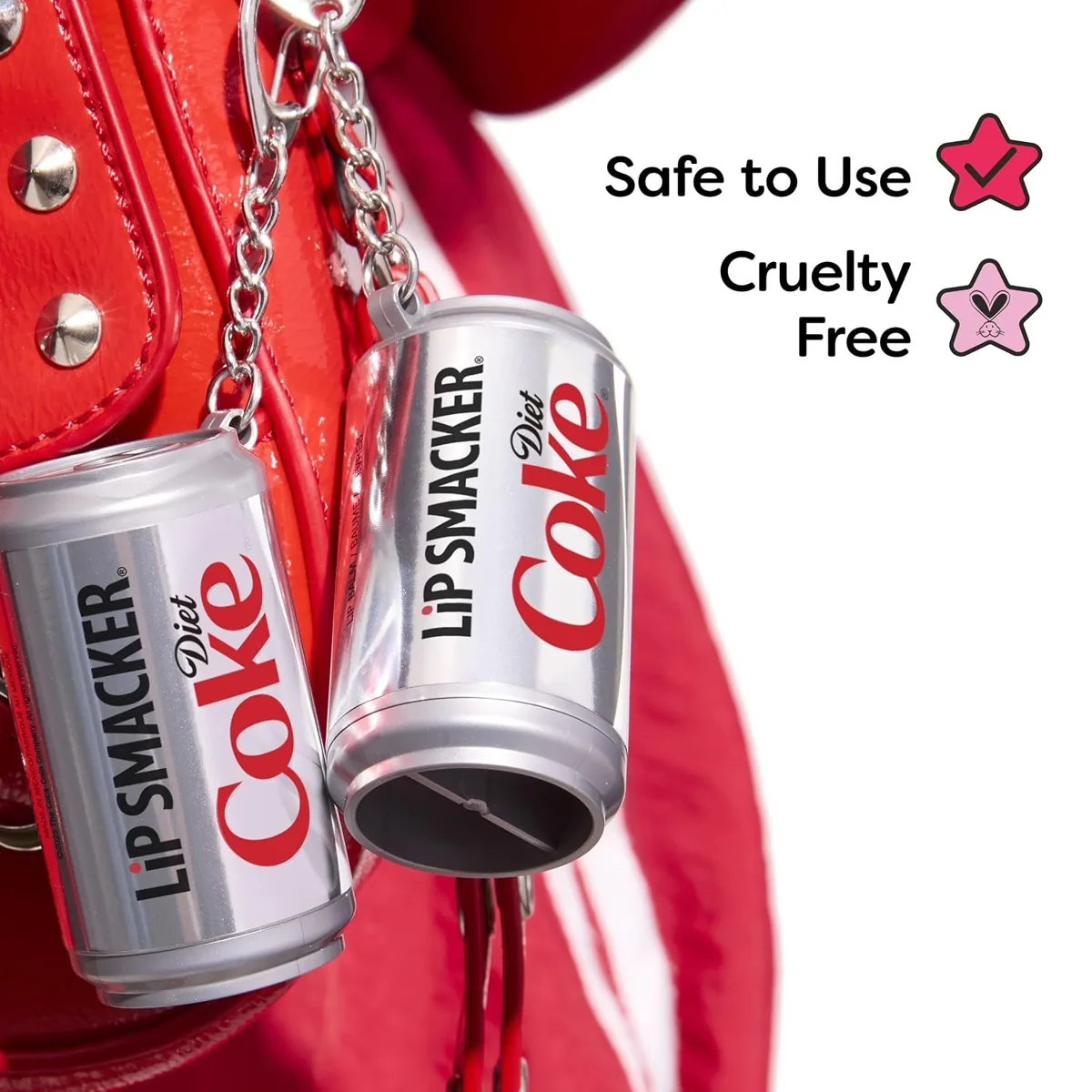 Diet Coke can-shaped lip balm keychain clipped to a shiny purse