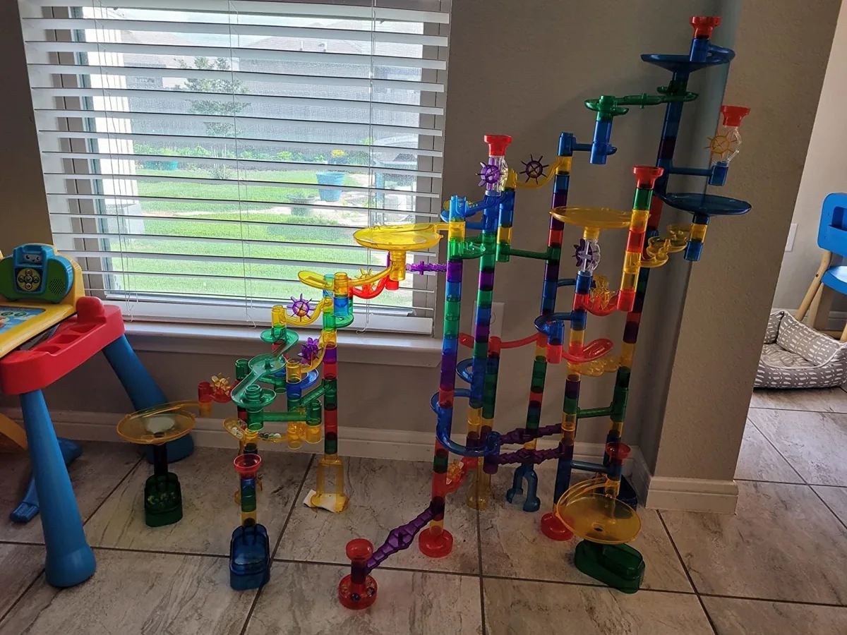 Tall colorful marble run built in a living room