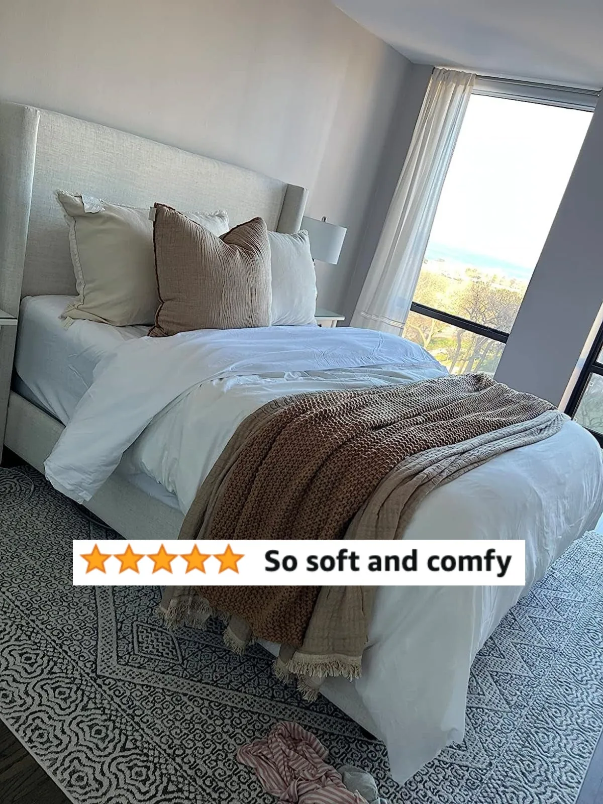 Bed made with soft white Mellanni microfiber sheets and a throw blanket