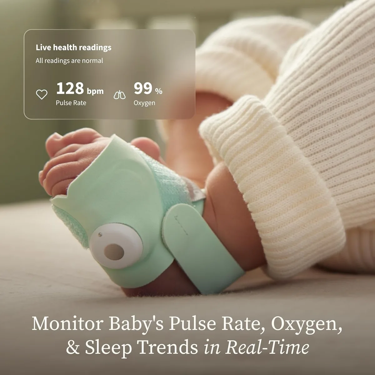 Owlet Dream Sock wrapped around a sleeping baby's foot with pulse and oxygen readings