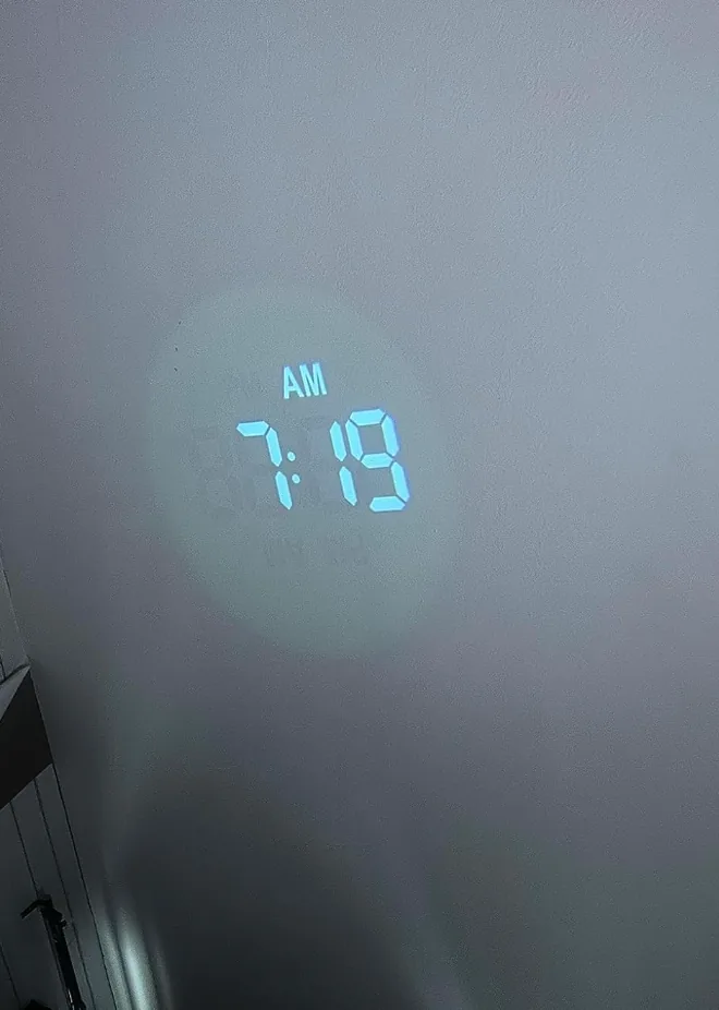 Projection alarm clock beaming the time onto a bedroom wall
