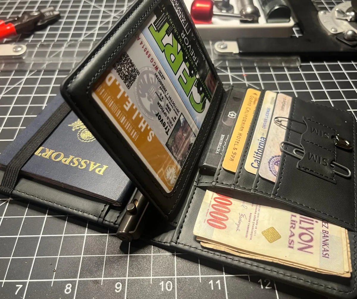 Open travel wallet holding a passport beside card slots and a boarding pass pocket