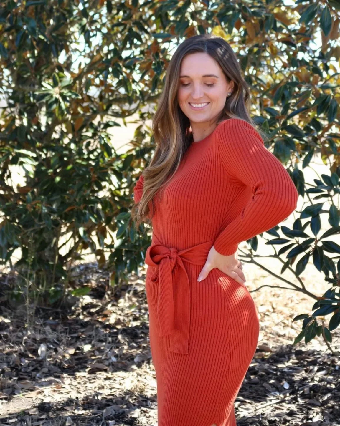 Burnt orange ribbed knit midi sweater dress with a tie waist