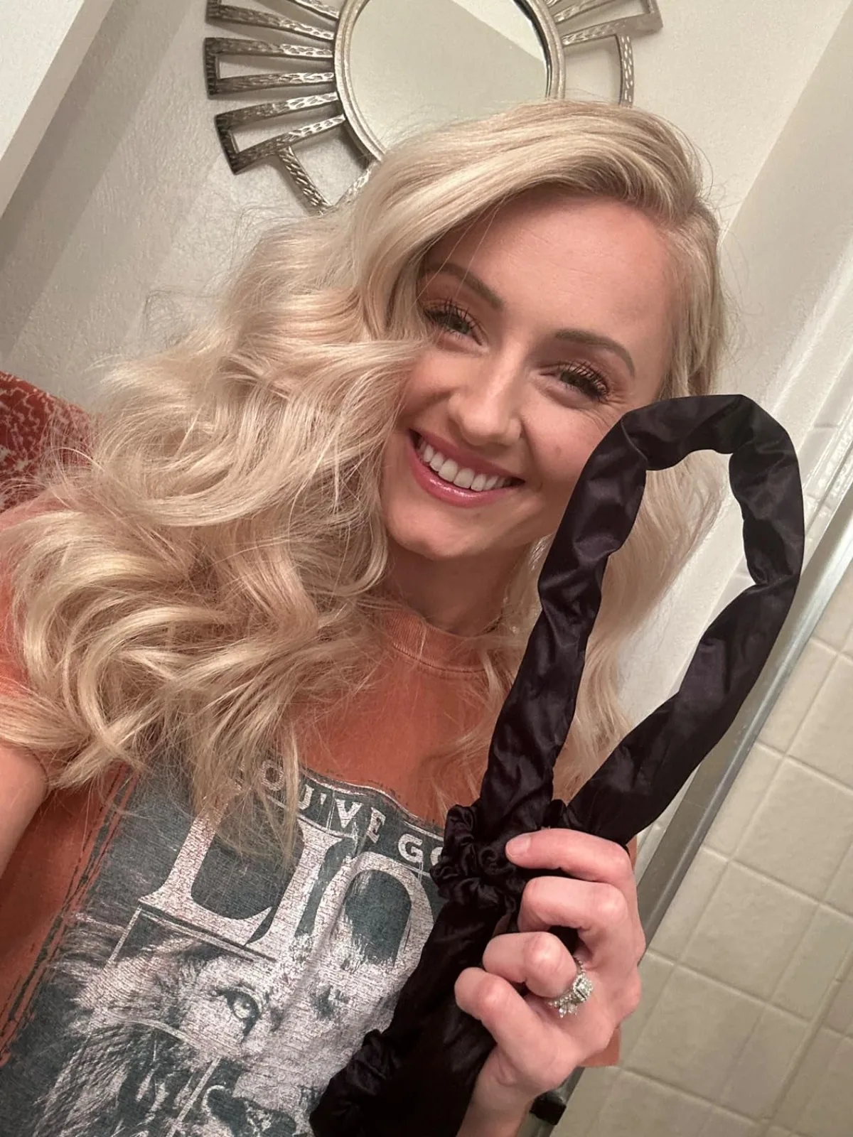 Long hair styled in soft curls made with a RobeCurls heatless rod