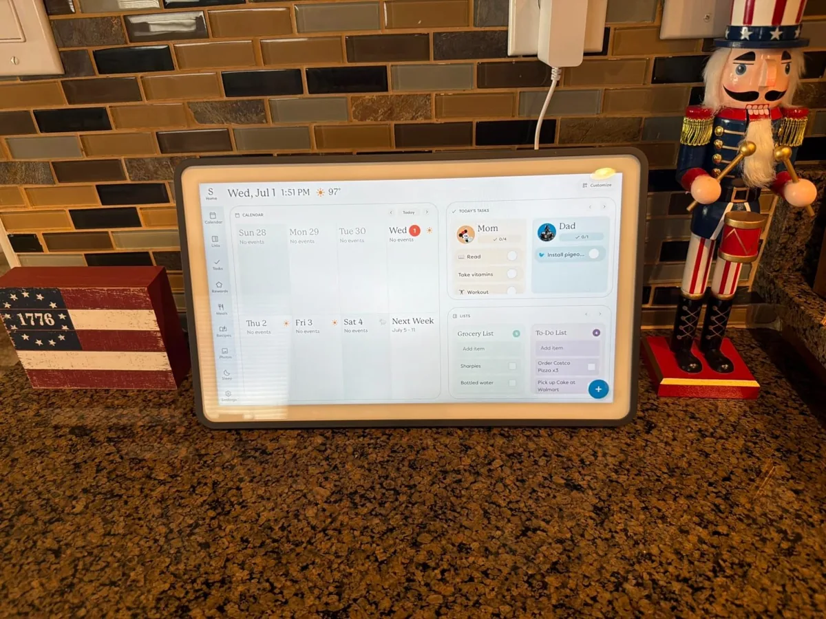 Skylight touchscreen family calendar showing the week, chores and lists on a kitchen counter