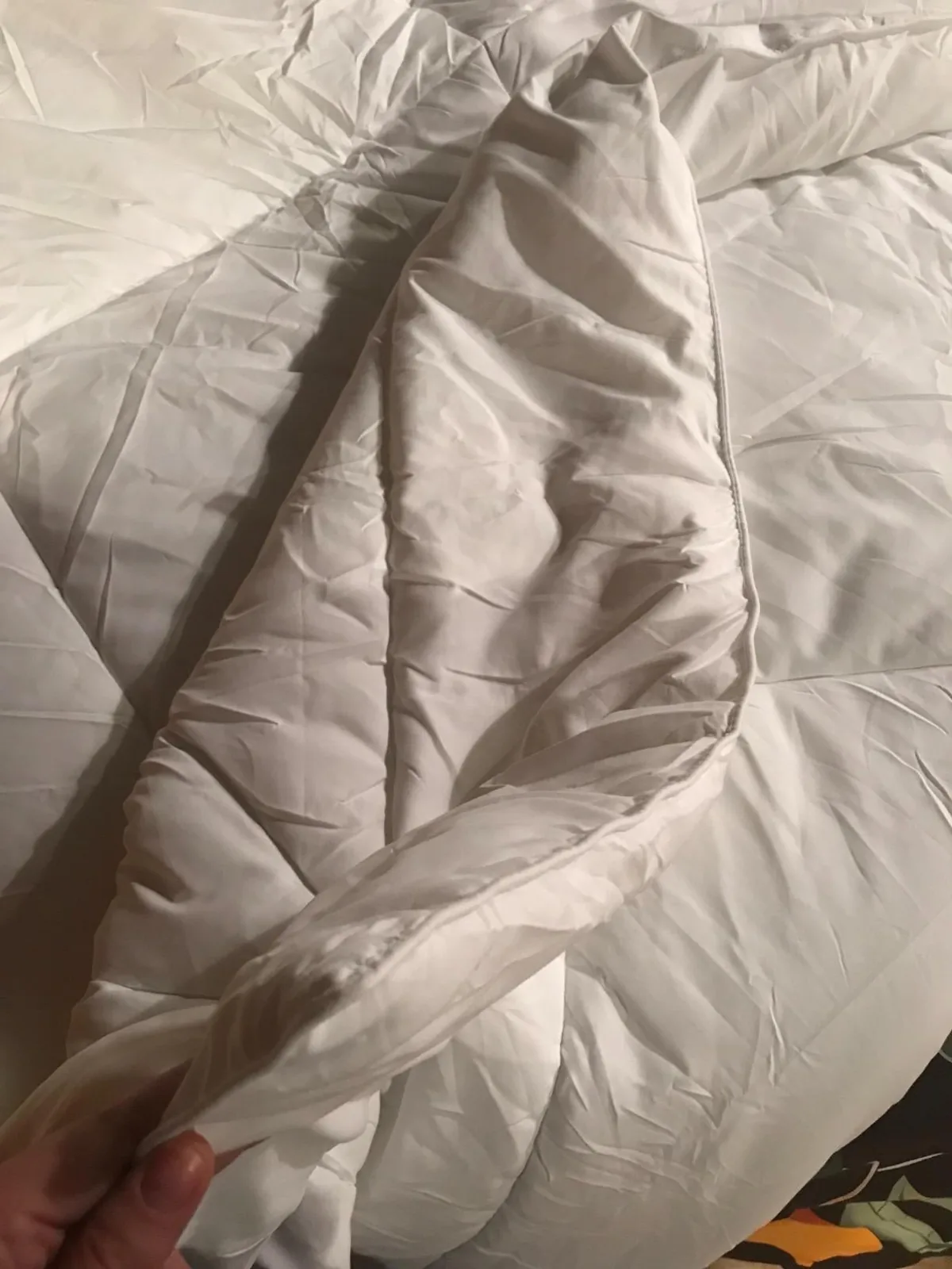 Close-up of a soft white quilted comforter