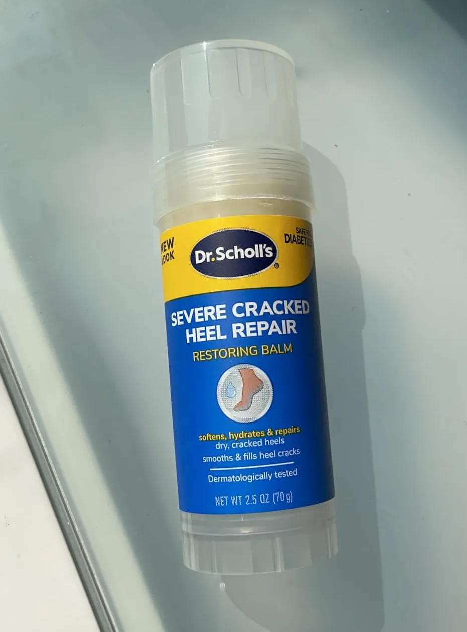 Dr. Scholl's cracked heel repair balm stick on a glass surface