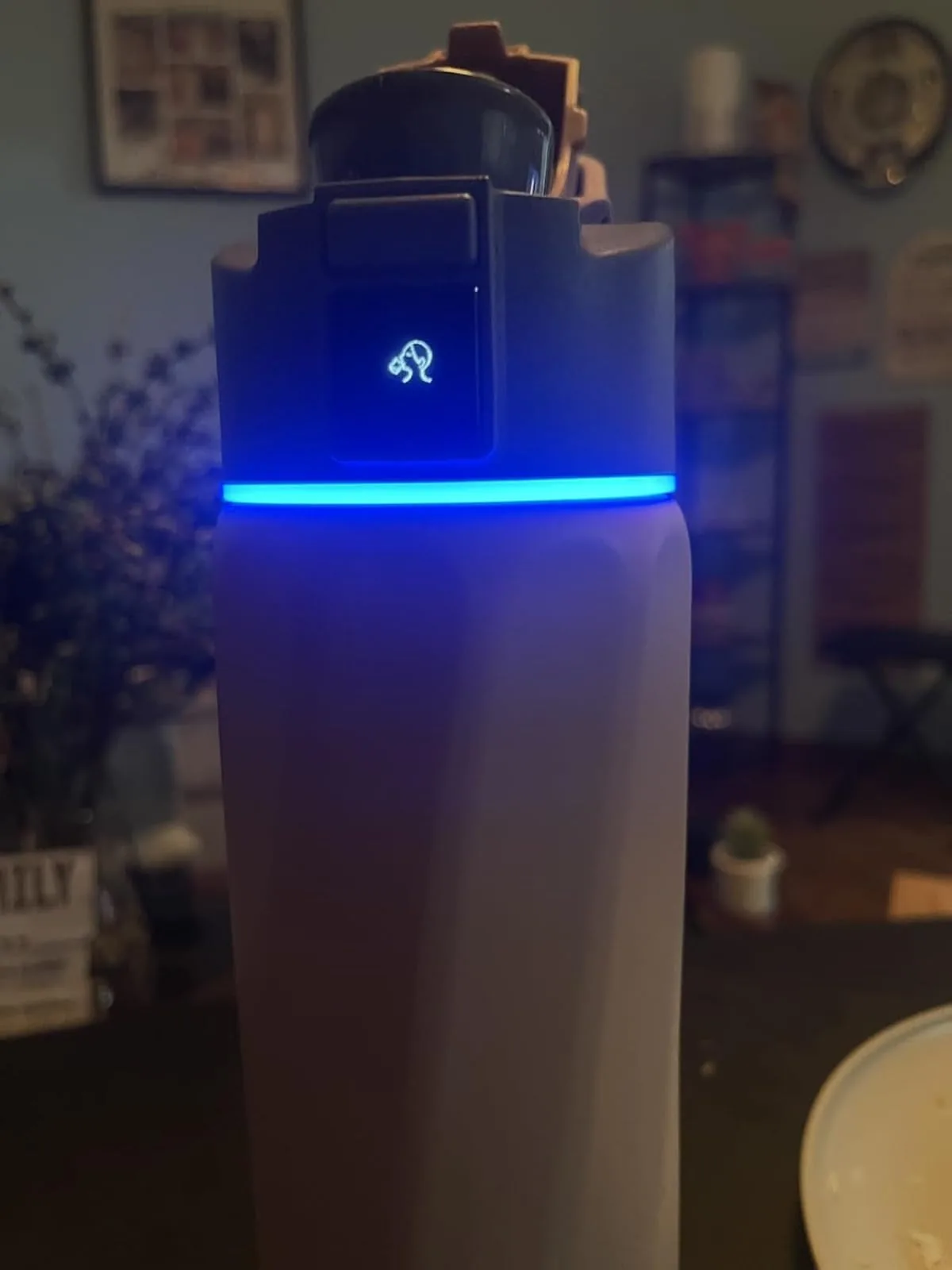 WaterH smart water bottle with its reminder light glowing blue