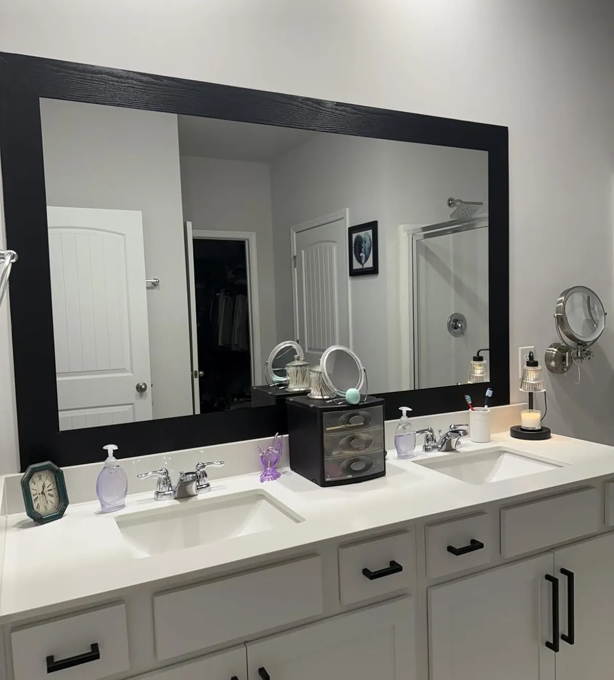 Bathroom mirror framed with black wood-grain peel-and-stick border tape