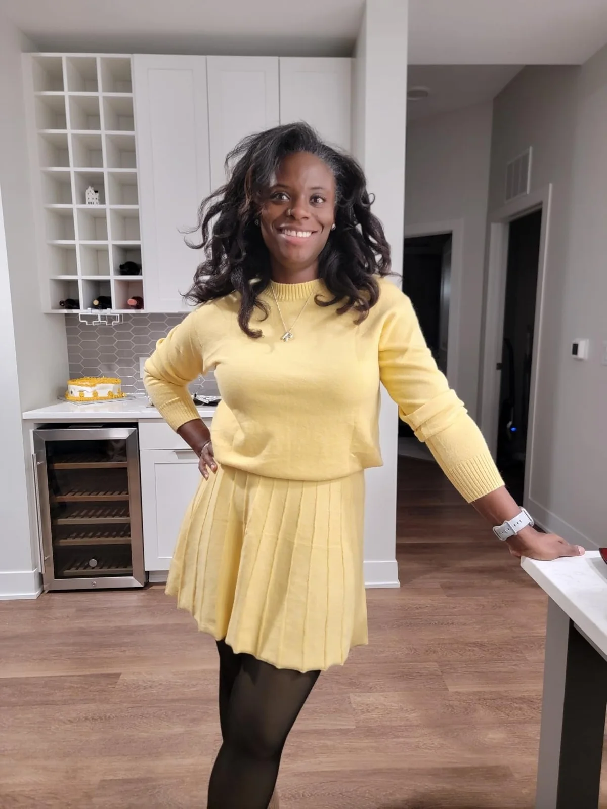 Butter-yellow knit sweater and pleated skirt matching set